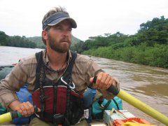 River guide Eddie Down rowing a boat
